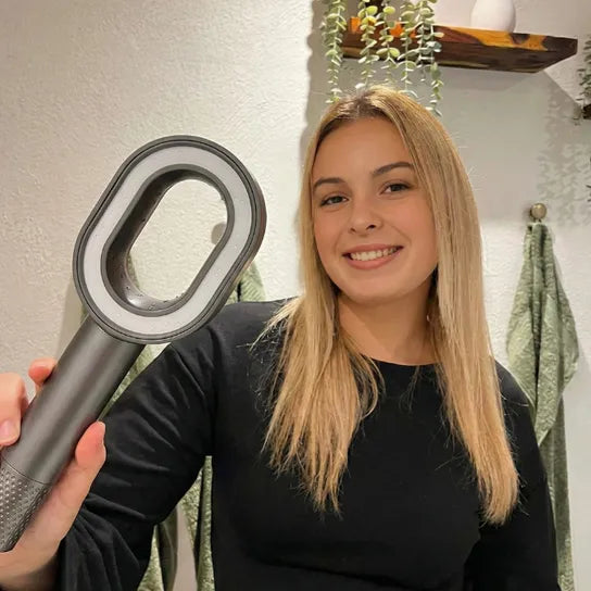 Blonde Woman smiling holding the PureRain Halo filtered showerhead